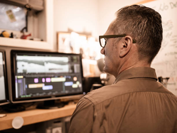 istock Male video editor working at home 1287927211