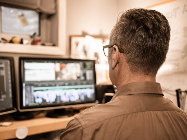 istock Male video editor working at home 1287927286