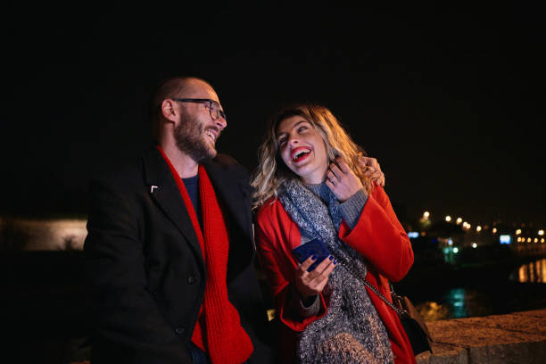 istock Joyful young couple laughing during their date and having so much fun together 1287930987