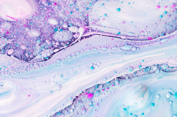 istock Fluid art texture. Background with abstract swirling paint effect. Liquid acrylic artwork with flowing bubbles. Mixed paints for baner or wallpaper. Lavender, aquamarine and white overflowing colors. 1287932814