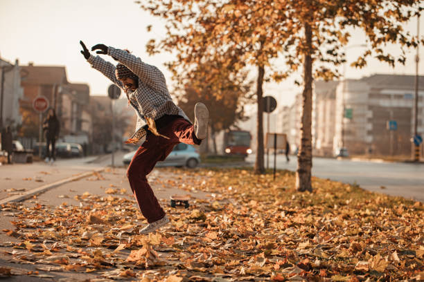 istock Jumping on autumn leaves like a little child 1287933830