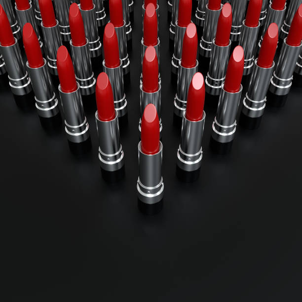 istock Creative presentation of red lipsticks at an angle on a black background. 3d illustration. Glamorous accessories. 1287933942