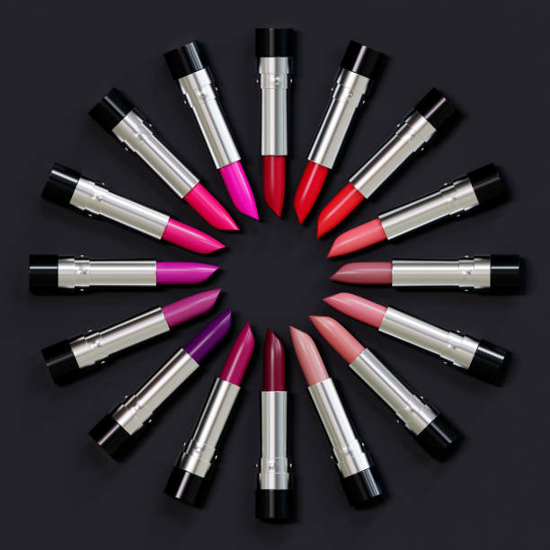 istock Presentation of lipsticks in different shades on a black background. 3d illustration. Glamorous accessories. 1287933949