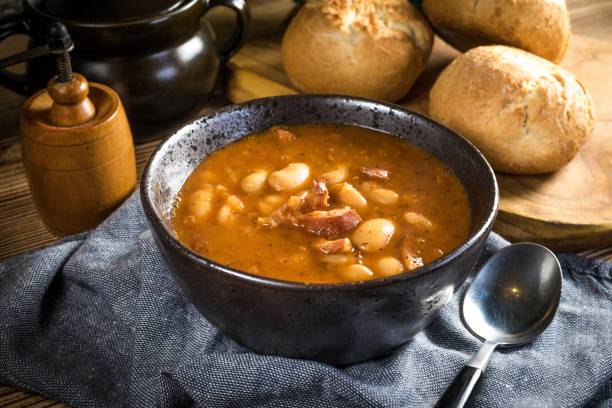 istock Beans with tomato sauce, bacon and sausage. 1287939582