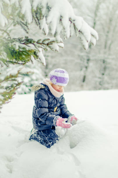 istock child and winter time having good time 1287940329