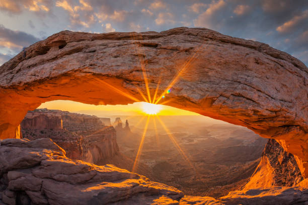 istock Famous sunrise at Mesa Arch 1287940632