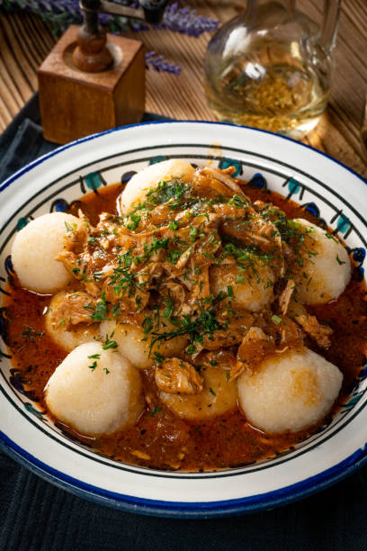 istock Dumplings with turkey and chorizo sauce. 1287941093