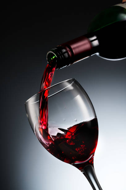 istock Glass of red wine and bottle 1287943207