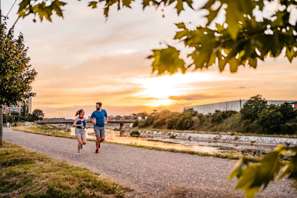istock Young couple running together 1287944443