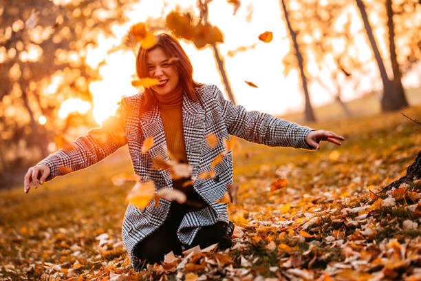 istock Throwing leaves in the air 1287944549