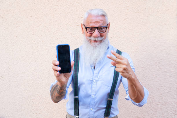 istock Senior man with a phone 1287945999