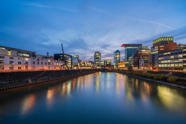 istock Duesseldorf media harbor at dusk 1287946275