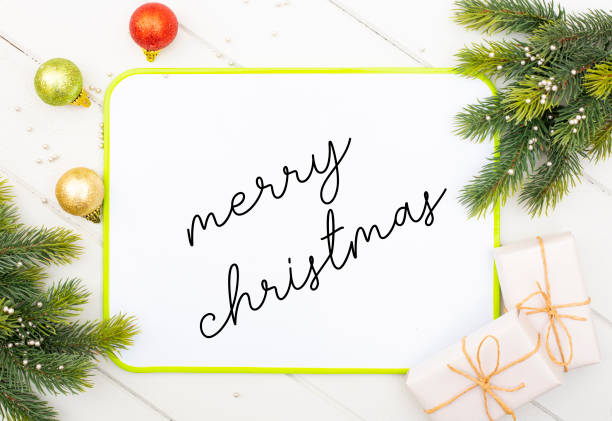 istock writes merry christmas message on white board with handwriting 1287951422