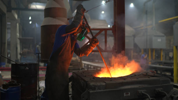 Metal industry work - steel furnace Metal industry work - steel furnace molten photos stock pictures, royalty-free photos & images