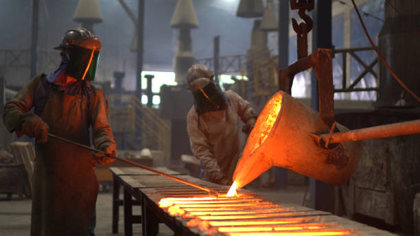 istock Metal industry work - pouring molten metal 1287953578