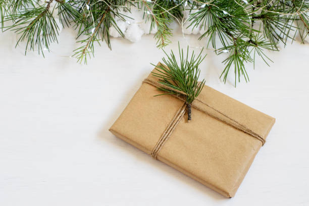 istock Handmade alternative Christmas gift box wrapped in grunge craft paper. Zero waste, plastic free, care package concepts. Mock-up photo. 1287958469
