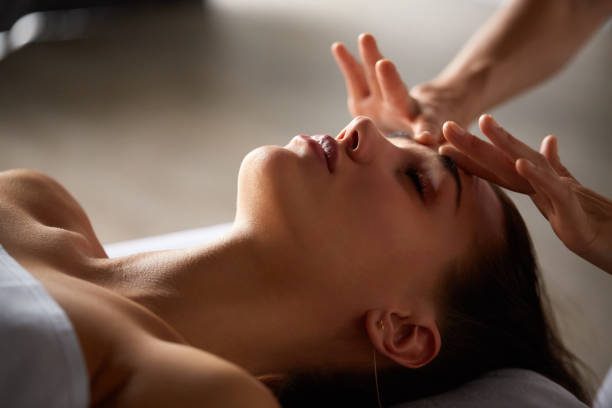 istock Head and face massage in spa salon 1287959563
