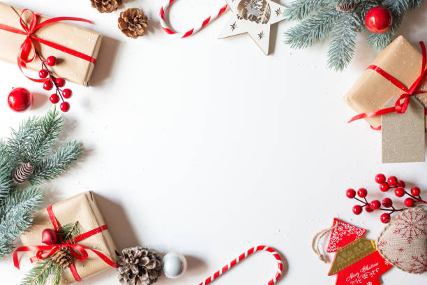 istock Christmas decorations are located around the perimeter of the image on a white background. 1287959678