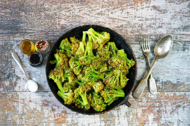 istock Baked broccoli in a pan with sesame seeds. 1287961512