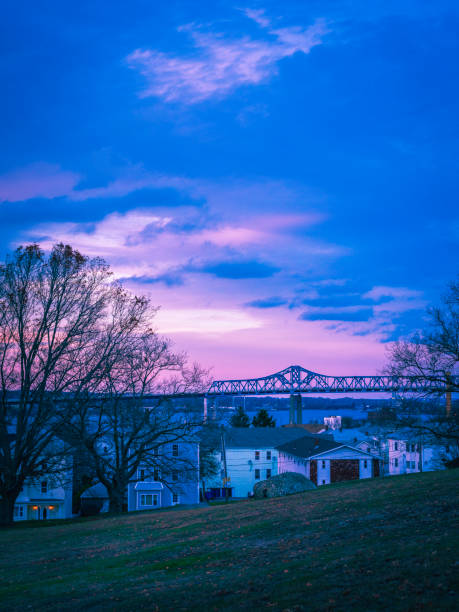 Dramatic twilight sky and clouds over Braga Bridge at Heritage State Park in Fall River, Massachusetts.