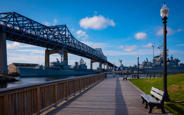 istock River Boardwalk with View of Braga Bridge at Sunset 1287964740