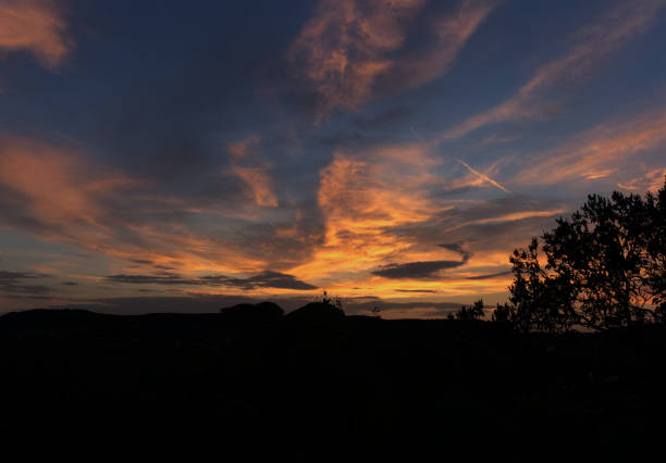 istock Dreamy sunset colours in thuringia with clouds at summer 1287964763