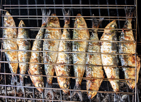 Roasted sardines at a popular party in Lisbon, Portugal.