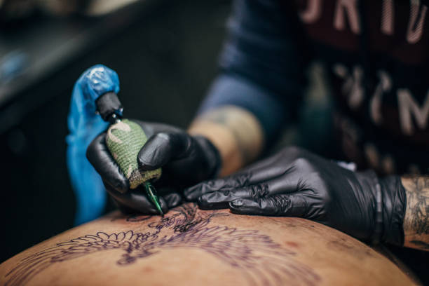 istock Artist tattooing a man in his studio 1287971098