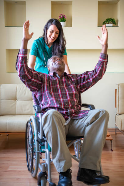 istock Professional experienced caregiver looking after her patient 1287973069