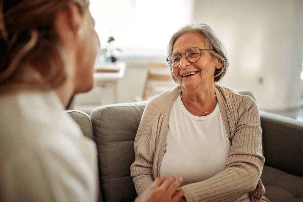 Everything's gonna be fine Female doctor consulting her senior patient seniors talking stock pictures, royalty-free photos & images