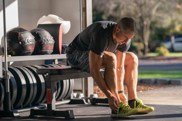 Athletic man preparing to do a workout in home gym set up in garage