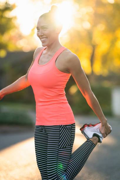 istock Happy woman stretching outside 1287983416