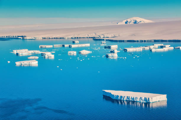 Close-up of glacier cross section reflection blue sky, Antarctica.
