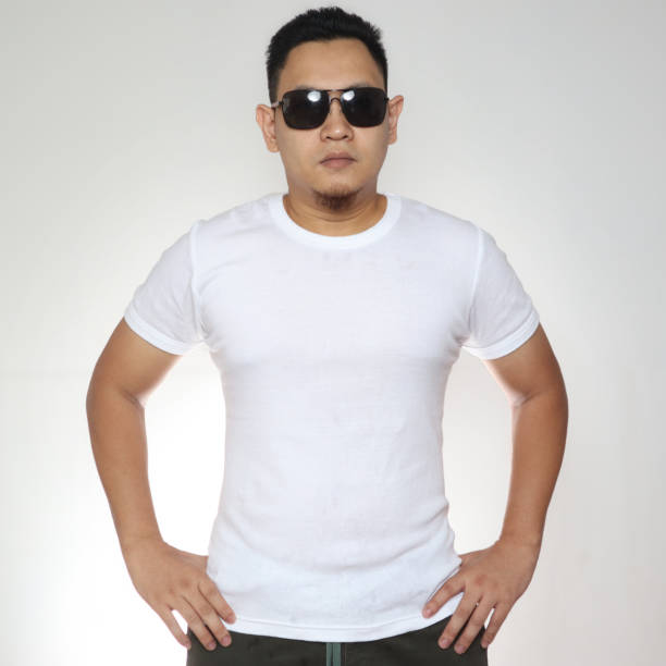 istock Young Man Wearing Sunglasses and  White Shirt 1287989120