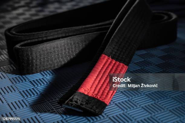 Close Up On Brazilian Jiu Jitsu Bjj Black Belt On The Tatami Mats Martial Arts Grappling And Training Concept Dark And High Contrast Filter Stock Photo - Download Image Now