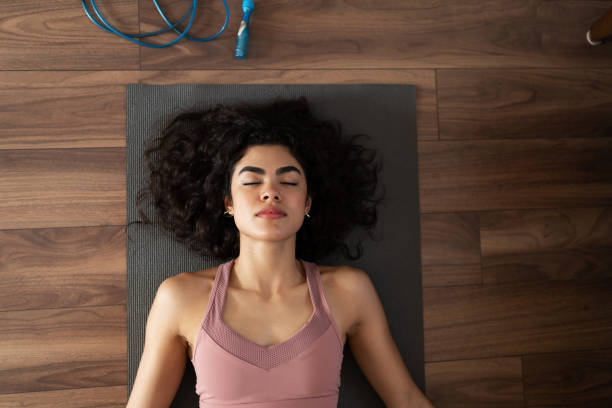 istock Fit woman resting after a hard home workout 1288000765