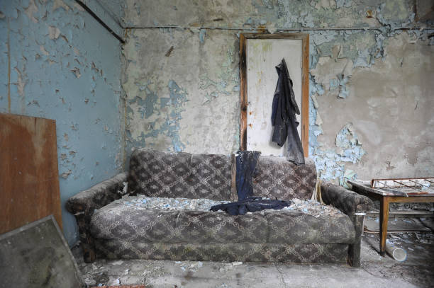 istock Room with sofa in abandoned plant Jupiter in Chernobyl zone 1288003772