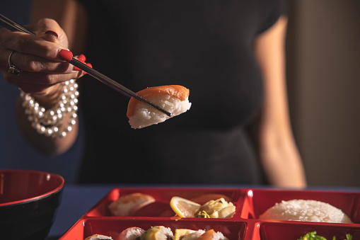Tuna sushi nigiri on white background. Asian cuisine, sushi menu, food for delivery.