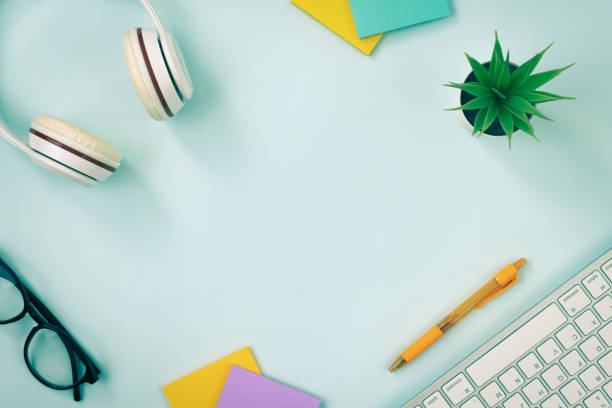 istock Modern Creative Top View Office Desk or Table on Blue Pastel Minimalist Background in Vintage Tone 1288015866