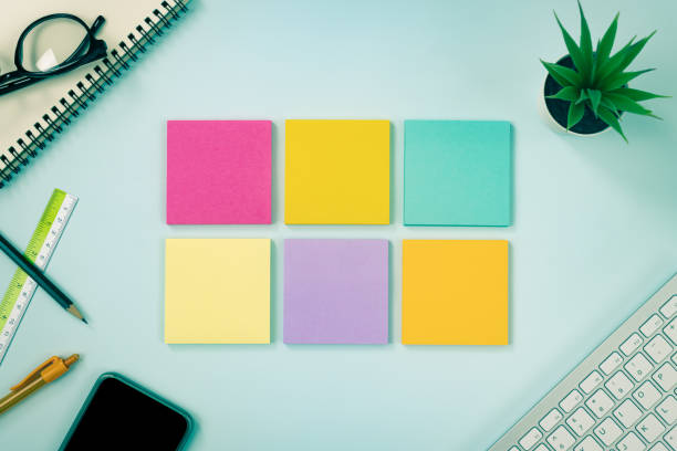 istock Top View 6 Color Sticky Note or Note Pad on Blue Pastel Minimalist Background in Vintage Tone 1288016418