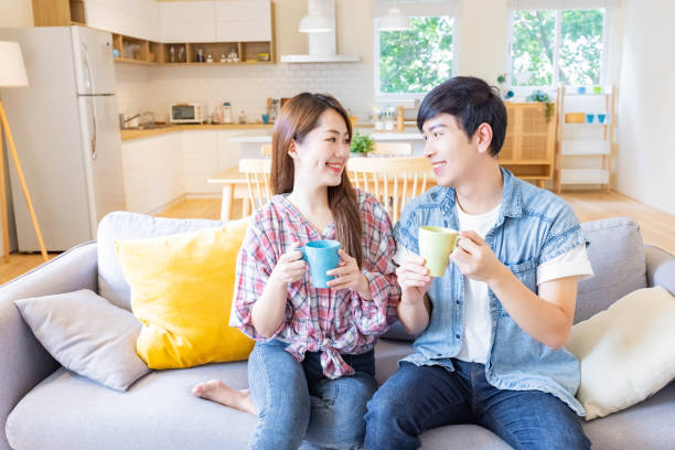 istock young couple chatting at home 1288018346