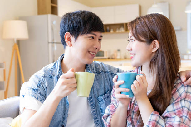 istock young couple chatting at home 1288018401