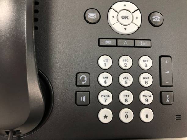 istock close up IP phone with numeric keypad for calling out to customers 1288021095