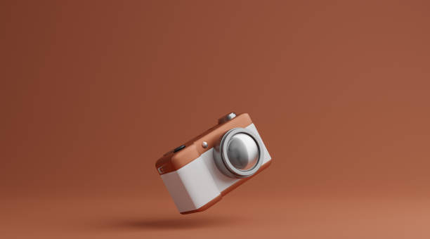 istock Brown and white camera over brown background photography concept. 3d rendering 1288034642