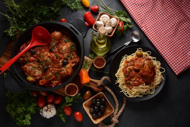 istock Italian chicken Cacciatore hunter's stew with spaghetti noodles 1288035219