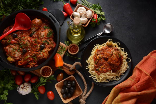 istock Italian chicken Cacciatore hunter's stew with spaghetti noodles 1288035287