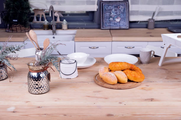 istock Nordic style kitchen interior with table kitchenware and croissants. Breakfast concept. 1288036971