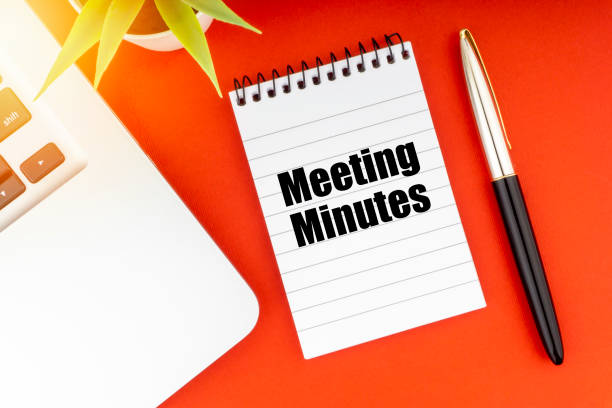 MEETING MINUTES text with notepad, laptop, fountain pen and decorative plant on red background. MEETING MINUTES text with notepad, laptop, fountain pen and decorative plant on red background. Business and Copy Space Concept minute hand photos stock pictures, royalty-free photos & images