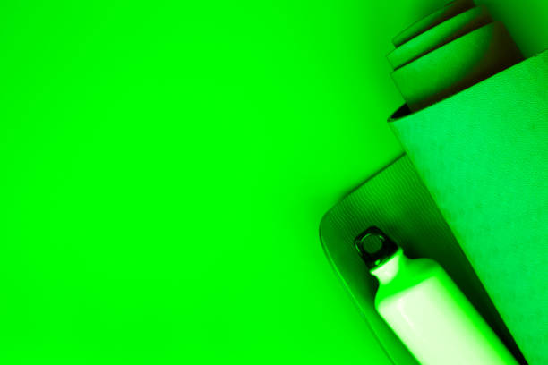 istock bright green ultramarine yoga mat on a verdant background 1288040331