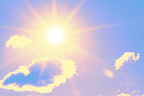 istock Bright sun with beautiful beams in the sky with clouds 1288040534
